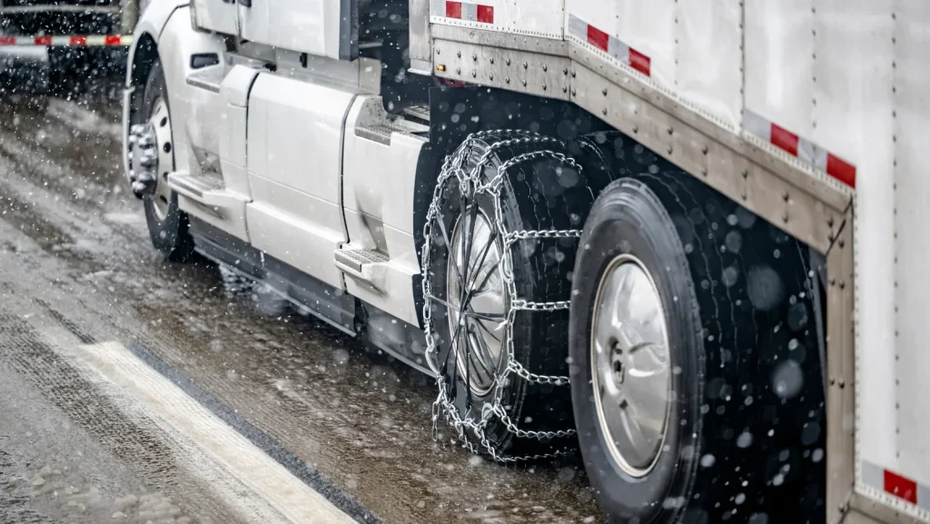 Here's Why Semi Truck Drivers Choose Snow Chains Instead Of Winter Tires